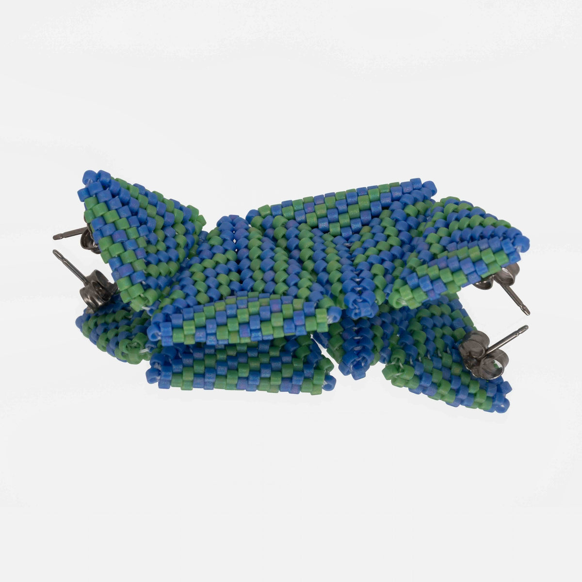Back of the blue and green beaded triangle earrings, showing titanium posts and butterfly backs