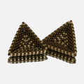 Pair of hand-woven beaded triangle earrings with diagonal bands of bronze, olive, and amber, standing on a mirror