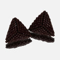 Pair of small hand-woven beaded triangle earrings in glossy and matte chocolate brown, standing on a mirror