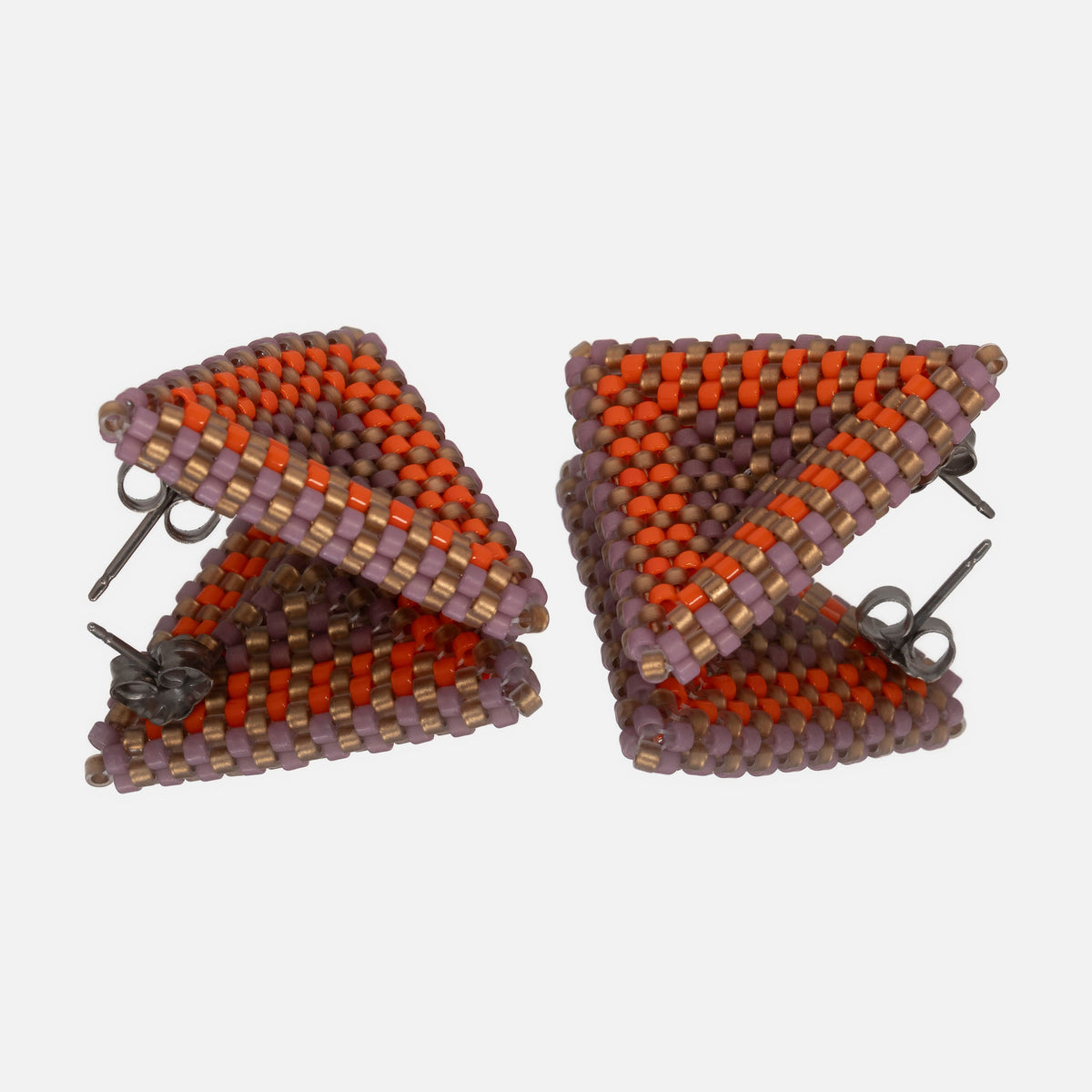 Back of the lilac, gold, and sunset orange beaded triangle earrings, showing titanium posts and butterfly backs