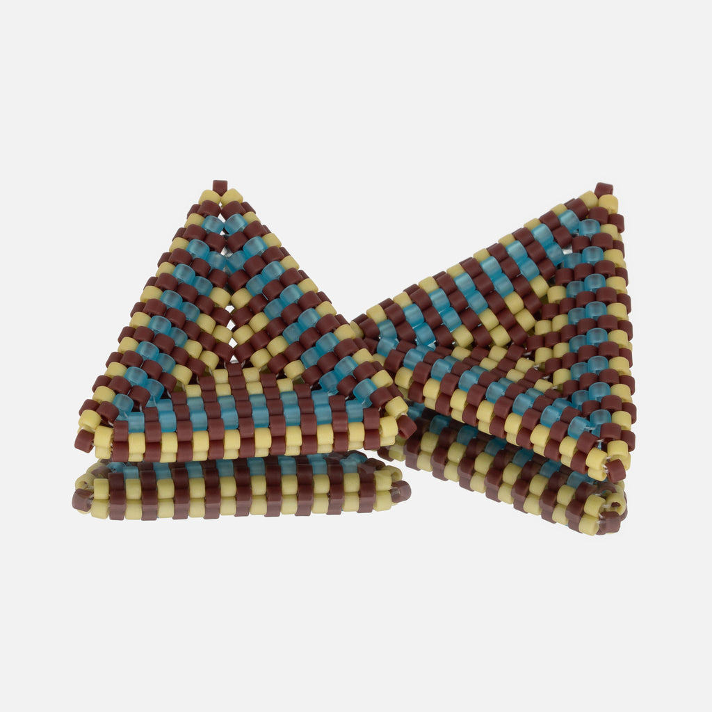 Pair of hand-woven beaded triangle earrings with oxblood, aqua, and spring green stripes, displayed on a mirror