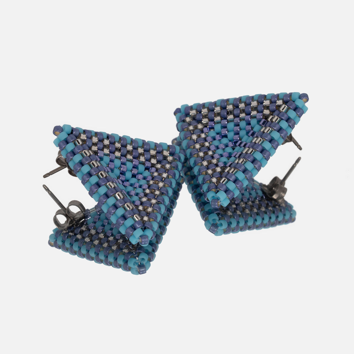 Back of the periwinkle, silver, and turquoise beaded triangle earrings, showing titanium posts and butterfly backs