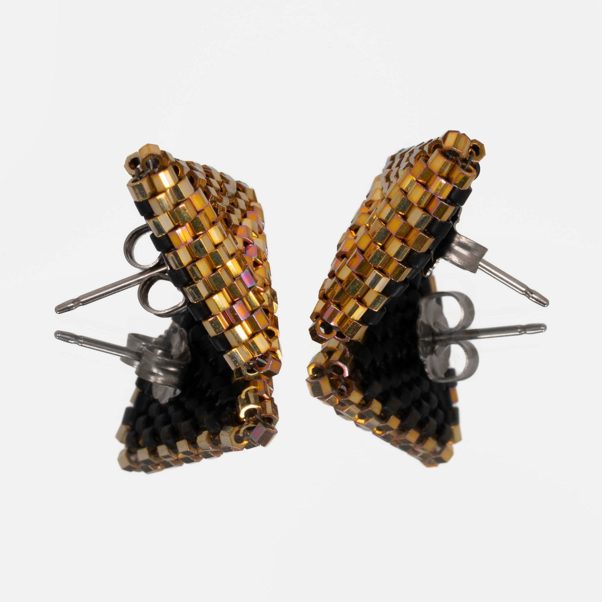 Back of the metallic gold beaded triangle earrings, showing titanium posts and butterfly backs