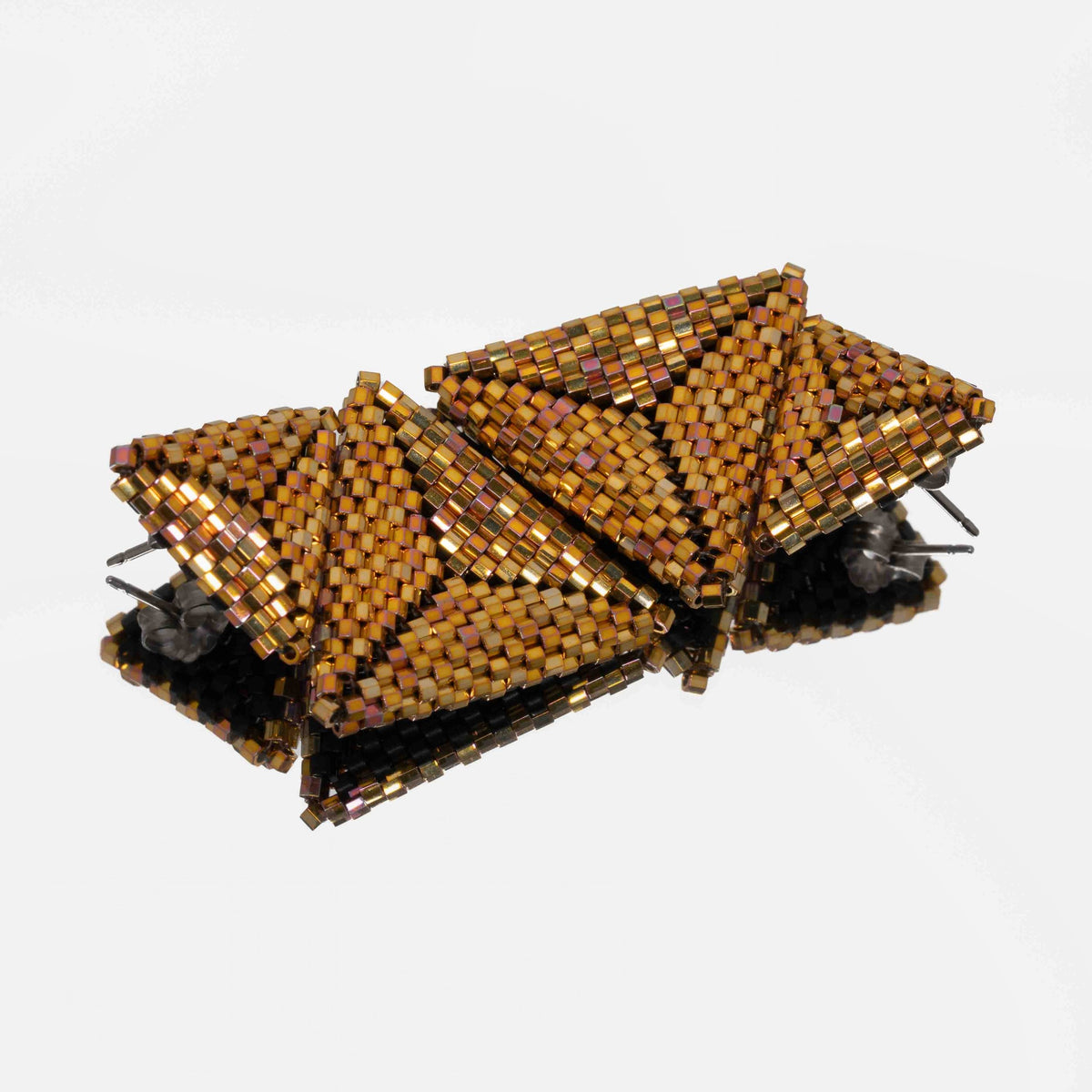 Back of the metallic gold beaded triangle earrings, showing titanium posts and butterfly backs
