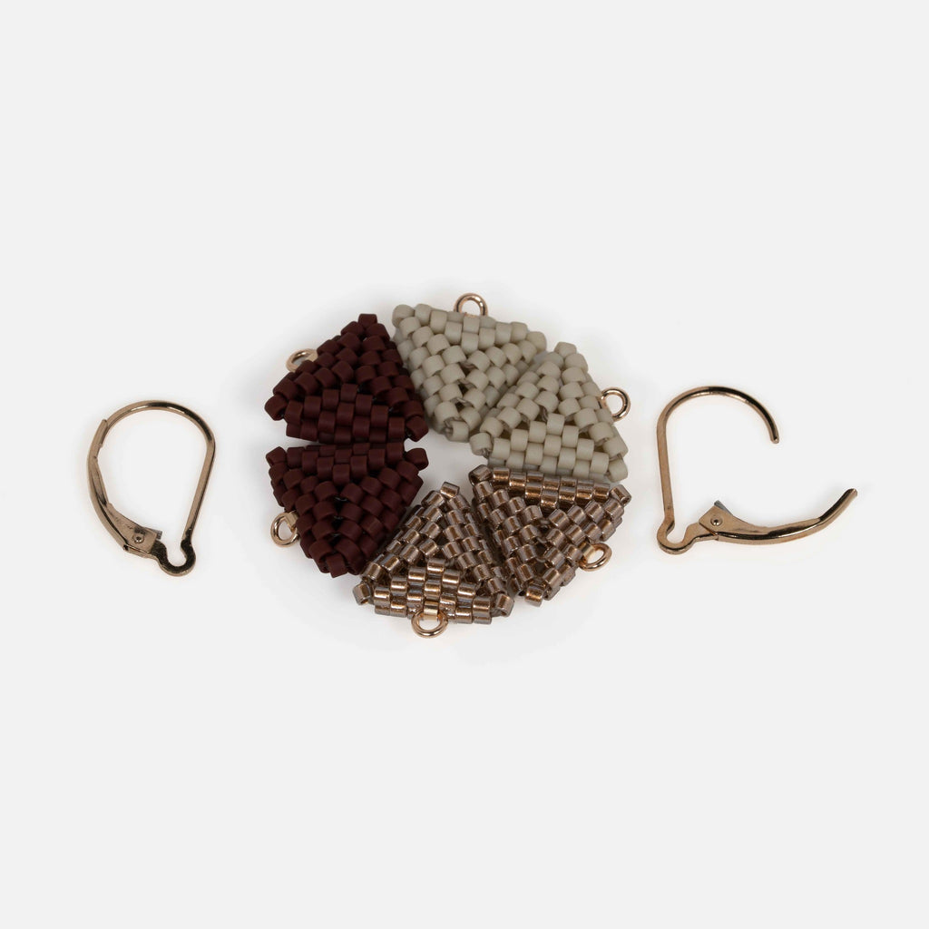 Three pairs of interchangeable beaded triangle modules in greige, antique copper, and oxblood, with one pair of gold-filled lever-backs.
