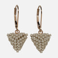 Pair of hand-woven greige beaded triangle earrings on gold-filled lever-backs, hanging against a white background.