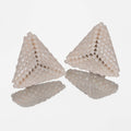 Pair of small hand-woven beaded triangle earrings in matte and pearly ivory, standing on a mirror