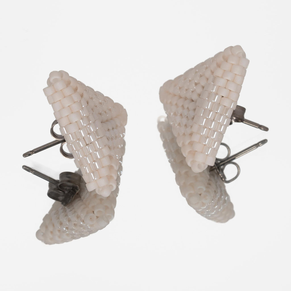 Back of the ivory beaded triangle earrings, showing titanium posts and butterfly backs