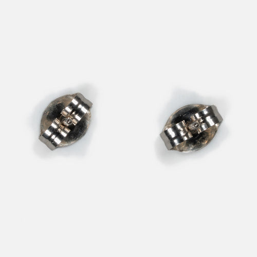 Back of a pair of MINIMA beaded stud earrings, showing sterling silver posts and friction ear nuts