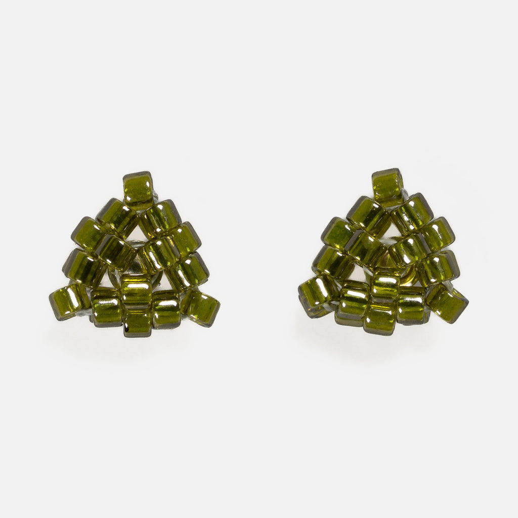 Pair of tiny triangular beaded stud earrings in transparent deep moss green, front view on a light gray background