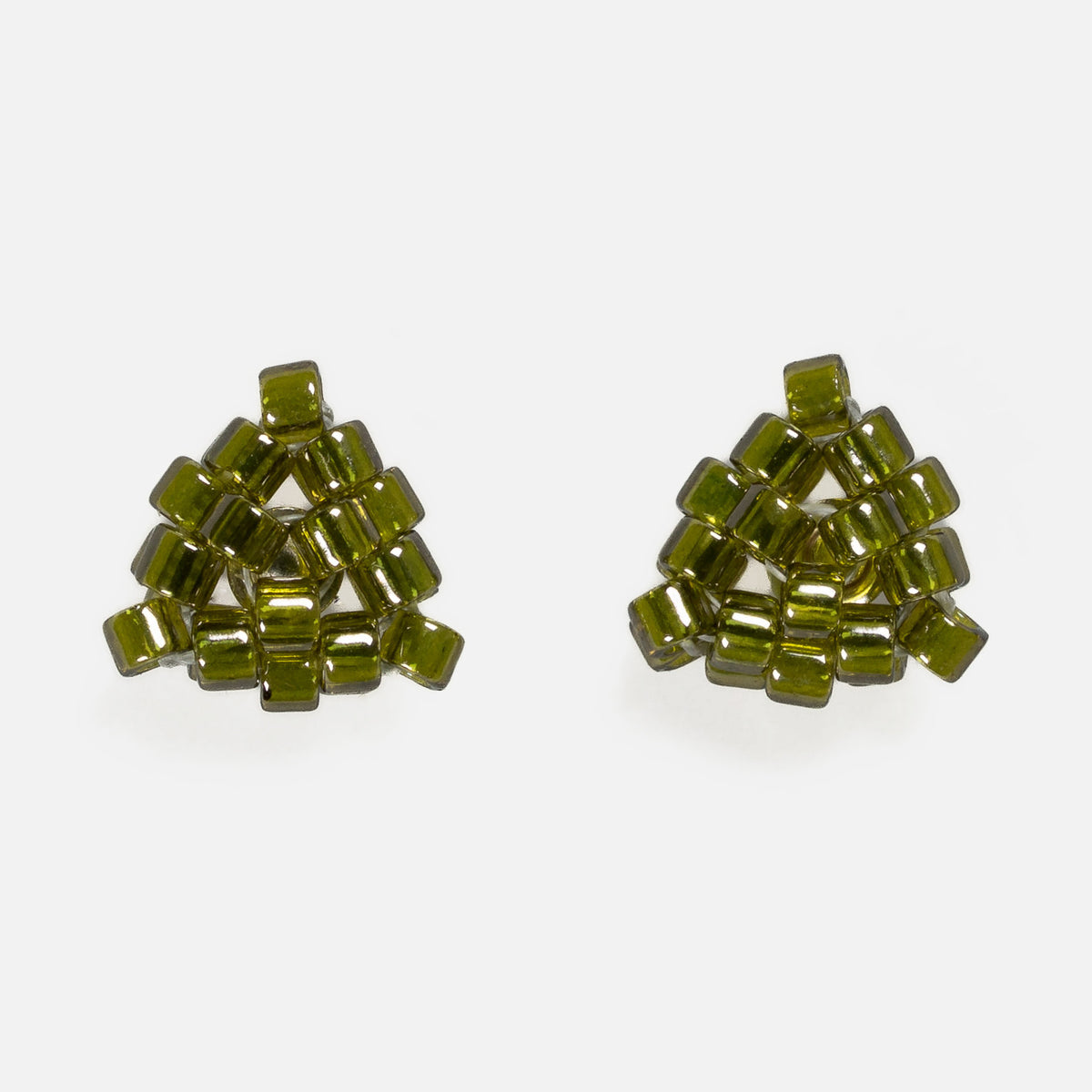 Pair of tiny triangular beaded stud earrings in transparent deep moss green, front view on a light gray background
