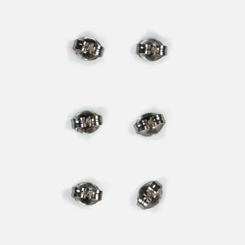 Back of three pairs of MINIMA beaded stud earrings, showing sterling silver posts and friction ear nuts