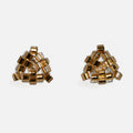 Pair of tiny triangular beaded stud earrings in gold-lined crystal hex beads, front view on a light gray background