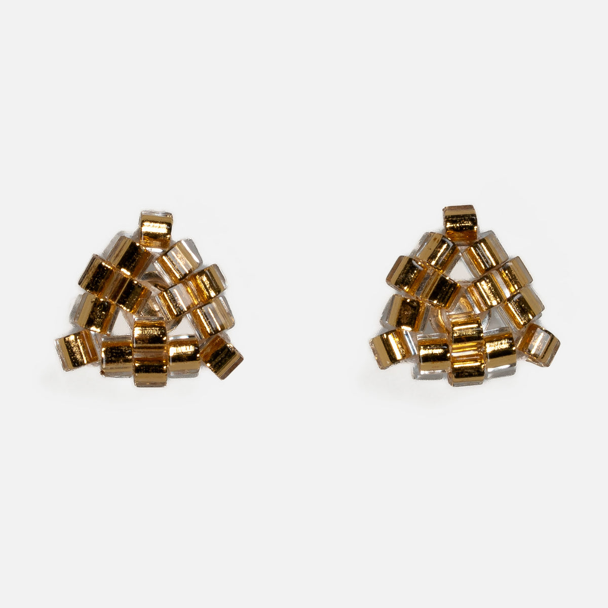 Pair of tiny triangular beaded stud earrings in gold-lined crystal hex beads, front view on a light gray background