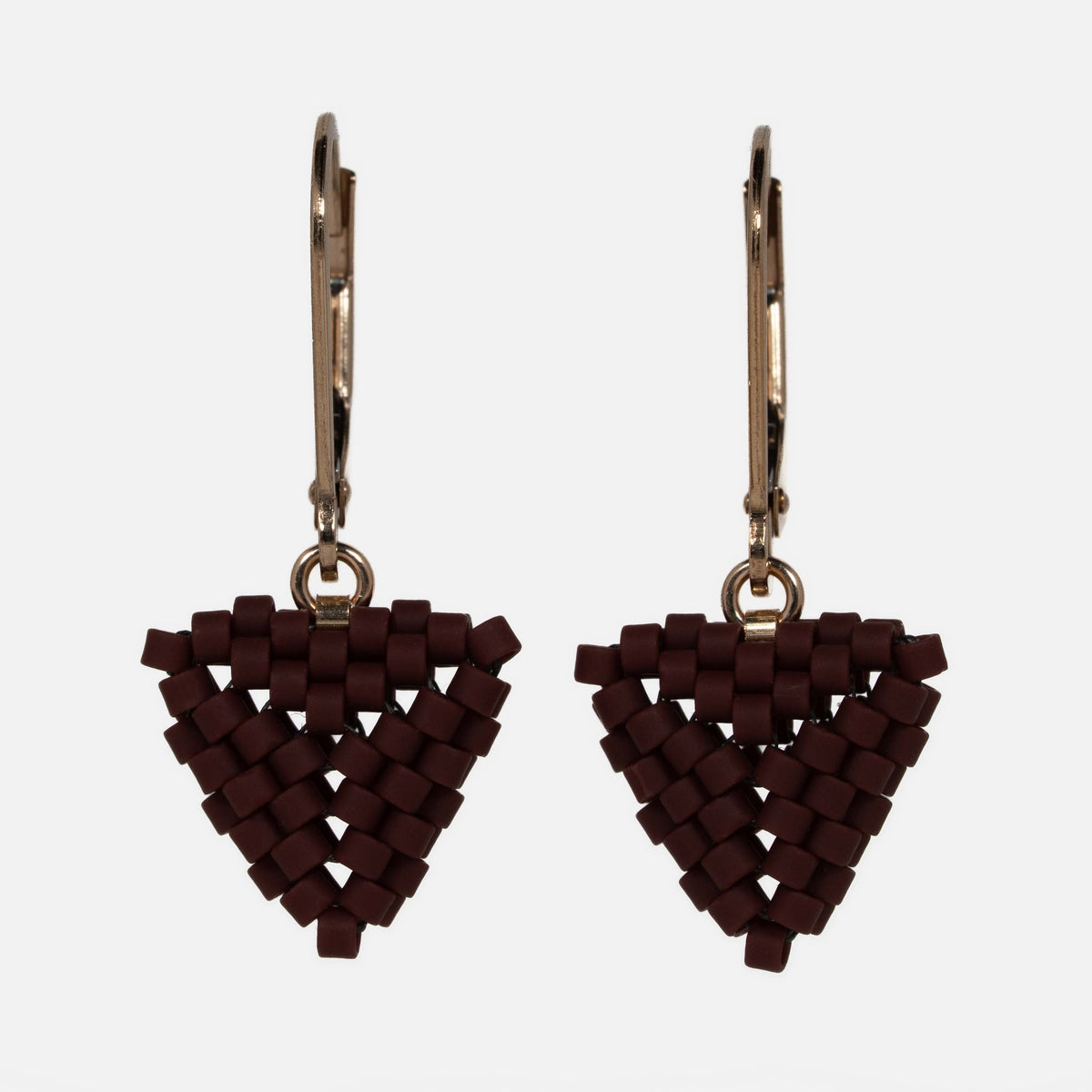 Pair of hand-woven oxblood beaded triangle earrings on gold-filled lever-backs, hanging against a white background.