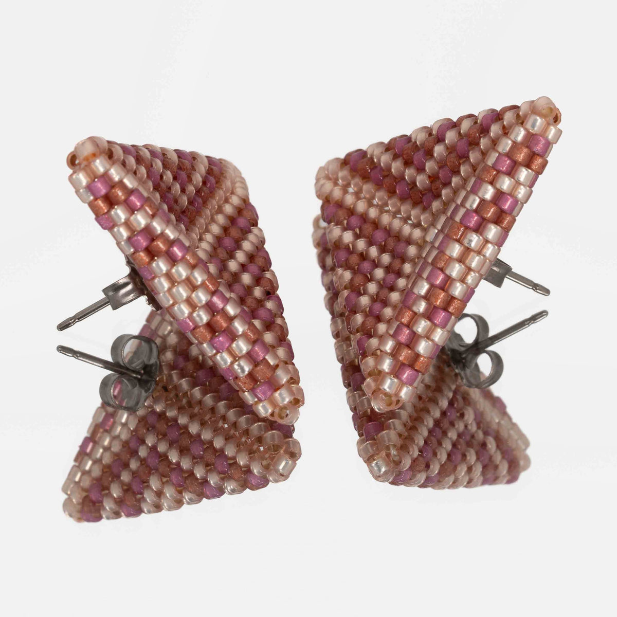Back of the peach, berry, and brick beaded triangle earrings, showing titanium posts and butterfly backs