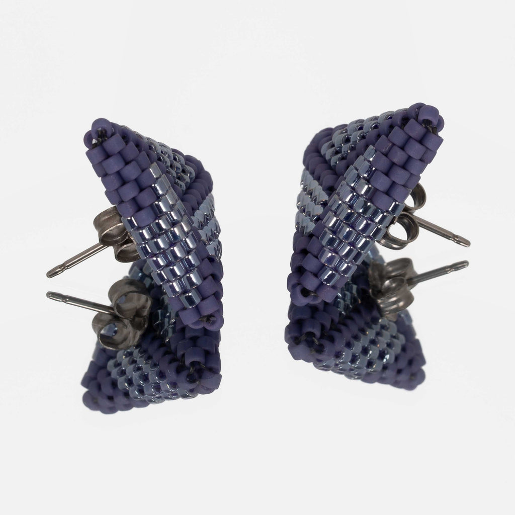 Back of the periwinkle beaded triangle earrings, showing titanium posts and butterfly backs