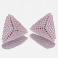 Pair of hand-woven pink lilac beaded triangle earrings, standing on a mirror