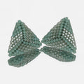 Pair of hand-woven sea green beaded triangle earrings, standing on a mirror