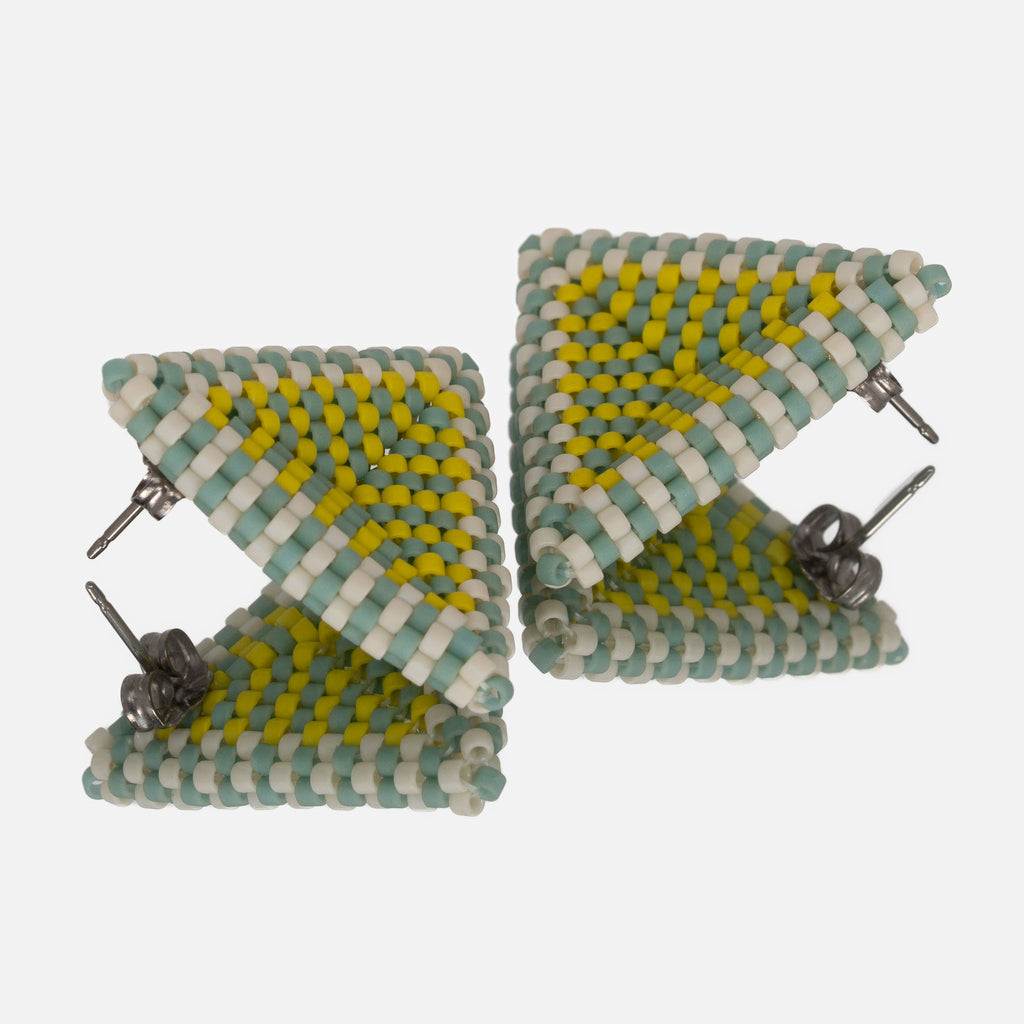 Back of the seafoam, beige, and lemon beaded triangle earrings, showing titanium posts and butterfly backs