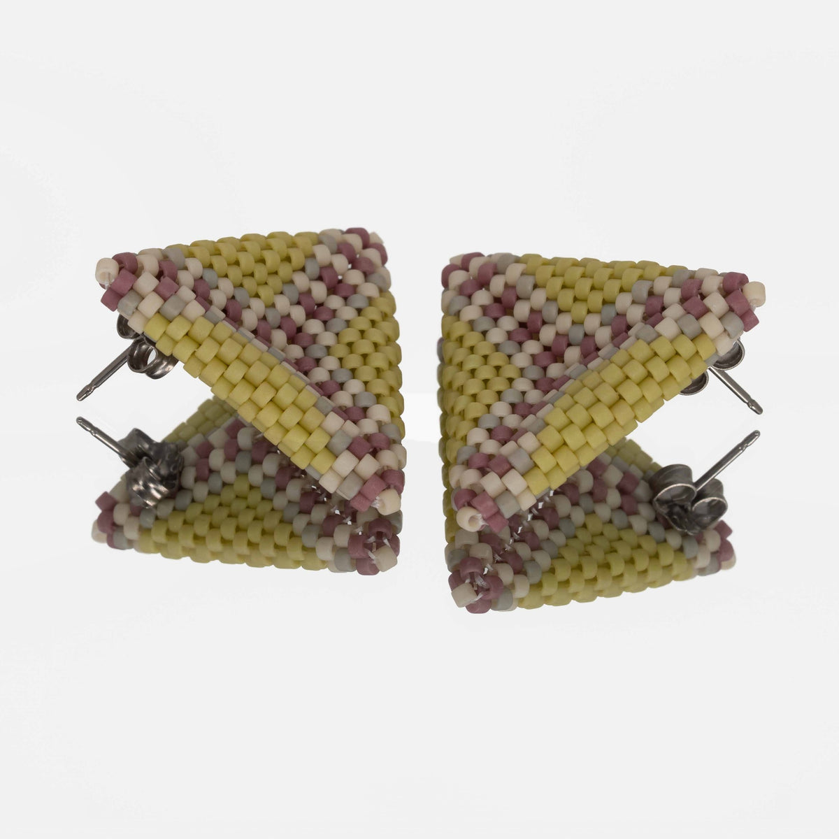 Back of the spring green, lilac, and cream beaded triangle earrings, showing titanium posts and butterfly backs